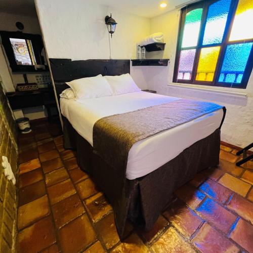 Ένα ή περισσότερα κρεβάτια σε δωμάτιο στο Hotel Boutique Samay