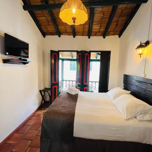 Ένα ή περισσότερα κρεβάτια σε δωμάτιο στο Hotel Boutique Samay
