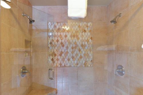 a bathroom with a shower with a glass door at Charming 2 bd Condo at Silverado in Napa