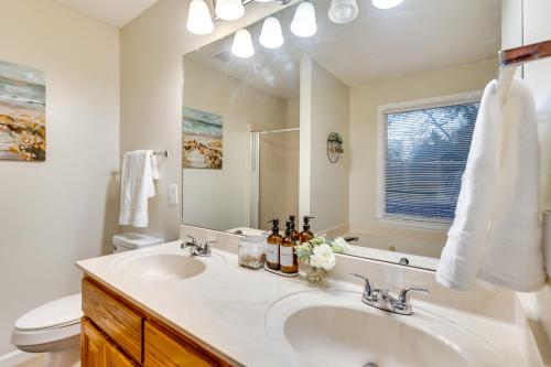 a bathroom with a sink and a mirror at Spacious Madison Vacation Rental with Backyard! in Madison