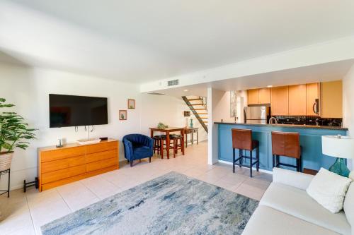 a living room with a couch and a kitchen at 1 Mi to Old Town! Snowbird Escape with Pool Access in Scottsdale