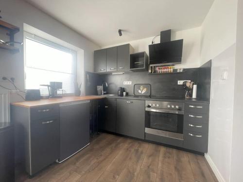 Kuchyň nebo kuchyňský kout v ubytování GRYT Home - FeWo XXL - Nähe Nordsee
