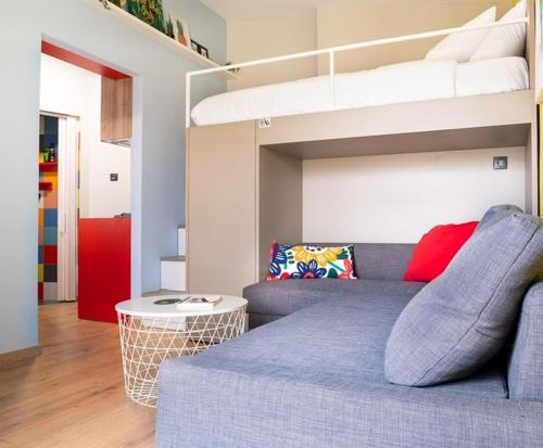 a room with a couch and a bunk bed at Deco city center apartment in Heraklio