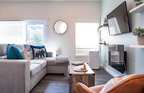 a living room with a couch and a table at Peak Paradise by Revelstoke Vacations in Revelstoke