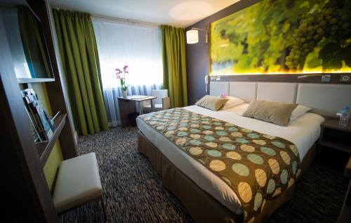 Katil atau katil-katil dalam bilik di Mercure Beaune Centre