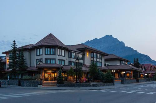 a building on the side of a street with a mountain at Elk + Avenue Hotel in Banff