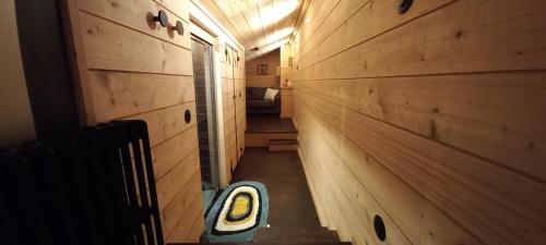 a hallway of a tiny house with a wooden wall at Villa Hortensia in Bagnères-de-Bigorre