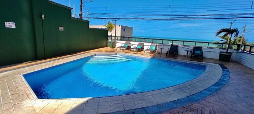 a swimming pool on the side of a building at Natal Plaza in Natal