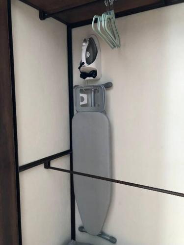 a mirror on a wall with a hair dryer at La Primera en La Candelaria in Bogotá