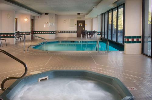 a swimming pool with a hot tub in a building at Drury Inn & Suites Springfield MO in Springfield