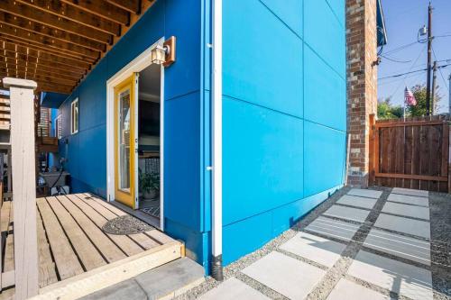 a blue house with a blue wall at Studio in West Seattle in Seattle
