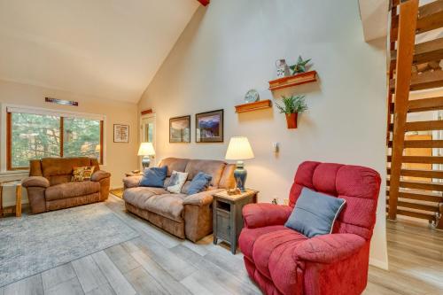 a living room with two chairs and a couch at Spacious Bartlett Condo with Balconies and Pool! in Bartlett
