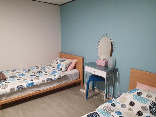 Letto o letti in una camera di Bunk Backpackers Guesthouse