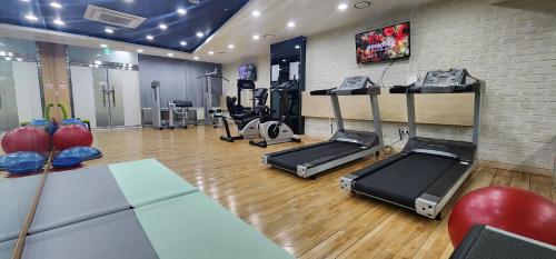 a gym with treadmills and exercise equipment in a room at Ever8 Serviced Residence in Seoul