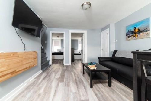 a living room with a couch and a table at -- AGH Walkable - Free Parking - Washer & Dryer -- in Pittsburgh