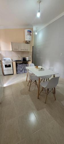 a kitchen with a table and chairs in a room at Departamentos Borges in Santiago del Estero