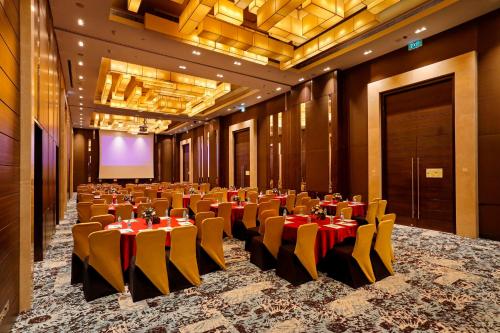 a banquet hall with tables and chairs in a room at Holiday Inn Chennai OMR IT Expressway by IHG in Chennai