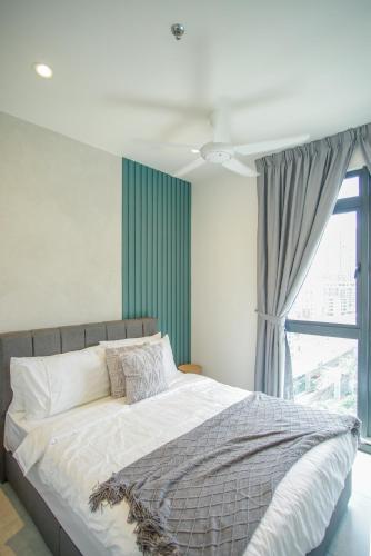 Ένα ή περισσότερα κρεβάτια σε δωμάτιο στο Neu Suites Ampang near LRT Jelatek
