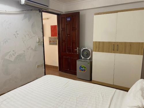 a bedroom with a bed and a tv in it at The Autumn Homestel in Hanoi