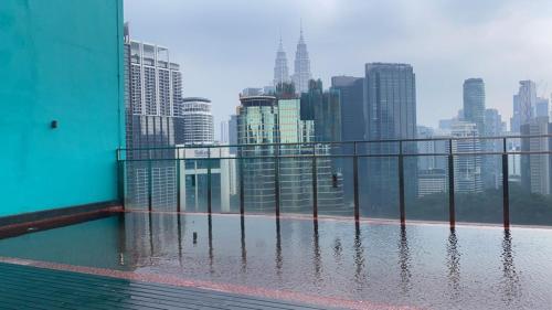 a view of a city skyline from a building at Studio Bedroom with Balcony in Kuala Lumpur