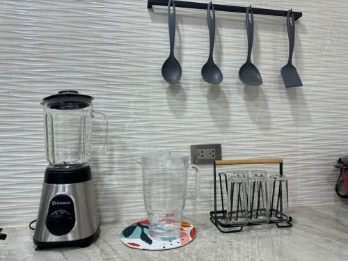 a blender and utensils hanging on a wall at Dpto. Estreno - Centro Histórico - 110 M2 in Trujillo