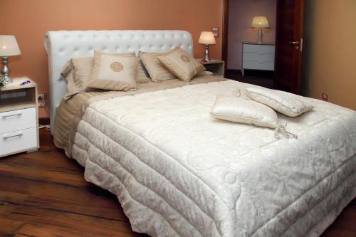 Säng eller sängar i ett rum på B&B Villa il Sughero