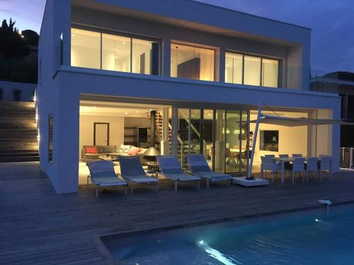 a house with a swimming pool in front of it at Villa Les Issambres, 5 pièces, 8 personnes - FR-1-768-37 in Les Issambres