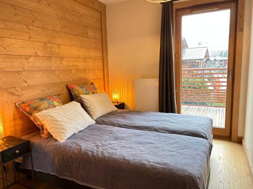 Appartement de standing 3 chambres, terrasse, centre Les Gets, proche commerces, parking inclus