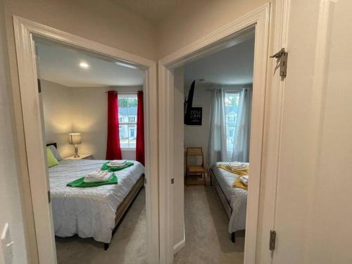a small bedroom with a bed and a mirror at Family friendly home WiFi modern comfort in Greenville