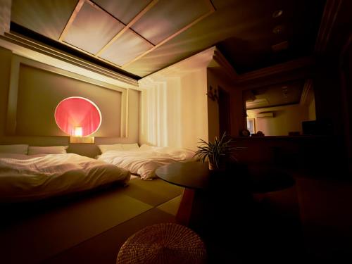 Hotel Ishigaki and Chikonkiyaにあるベッド