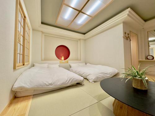 Hotel Ishigaki and Chikonkiyaにあるベッド