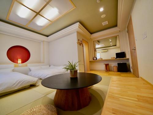 Hotel Ishigaki and Chikonkiyaにあるベッド