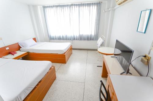 Ένα ή περισσότερα κρεβάτια σε δωμάτιο στο Tokyo Hotel