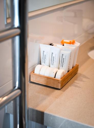 a group of toiletries on a shelf in a refrigerator at Mansfield Apartments in Mansfield