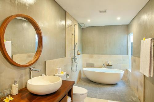Kylpyhuone majoituspaikassa Palasari Villa