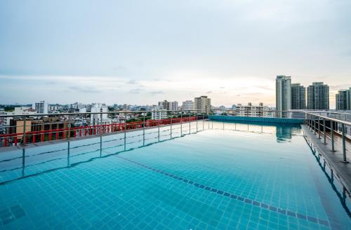 a swimming pool on the roof of a building at Hotel Style Colombo Studio Apartment in Colombo