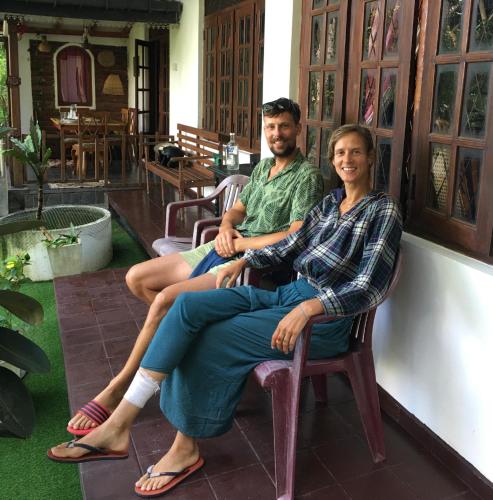 a man and a woman sitting in chairs at Villa25 Homestay free pick up from the centre in Kandy