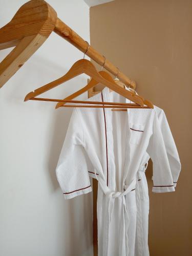 a white shirt is hanging on a hanger at BeachWalk Koh Rong in Koh Rong Island
