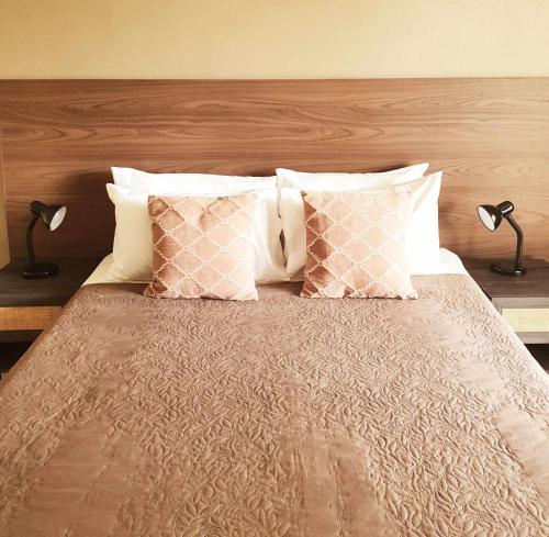 Ένα ή περισσότερα κρεβάτια σε δωμάτιο στο Vaea Hotel Samoa