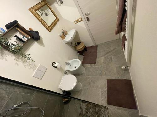 a bathroom with two toilets and a sink in a room at Le Bon Bon CIR-TORGNON-0017 in Torgnon