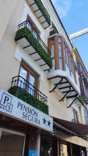 a building with a sign for a pension sephora at Pension Segura in Murcia