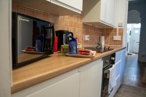 a kitchen with a counter top with some items on it at Chatham house in Etruria