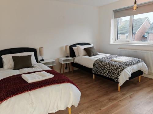 מיטה או מיטות בחדר ב-Charming 5 Bedroom House in Bexley