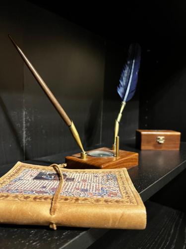 two utensils sitting on a table next to a box at The Knight and the Pomegranate - Luxury Medieval Villa in Rhodes Town