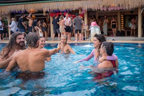 a group of people in a swimming pool at Sense Asia in Haad Tian