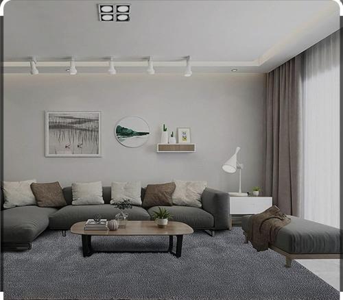 ein Wohnzimmer mit einem Sofa und einem Tisch in der Unterkunft Necdet apartman in Pasakoy