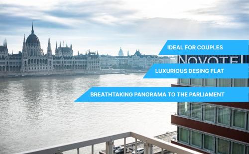 una vista del río Danube en Budapest y del parlamento en Riverside luxury panorama home - SmartTV, FastWiFi, en Budapest