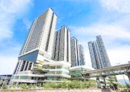 a group of tall buildings in a city at Cozy MRT-Linked Unit, DSara Sentral SOVO #DS1 in Sungai Buluh