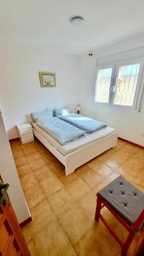 a bedroom with a large bed in a room at MEDDAYS VILLA SOL in Miami Platja