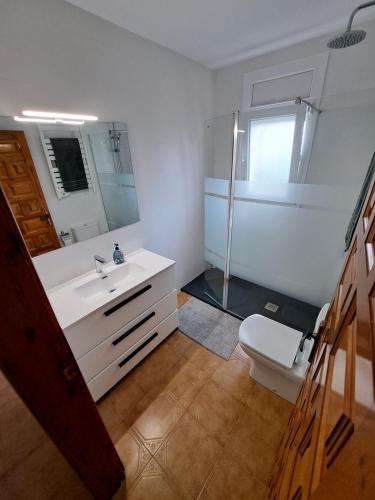 a bathroom with a white sink and a toilet at MEDDAYS VILLA SOL in Miami Platja